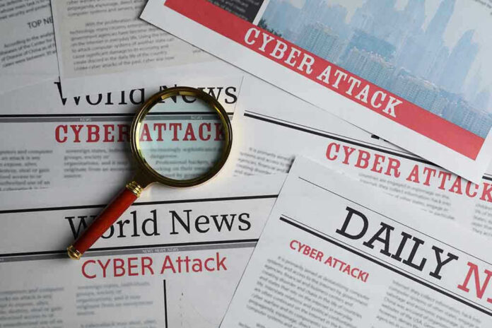 Newspapers with Cyber Attack headlines and a magnifying glass.