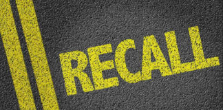 Yellow RECALL text on asphalt background.