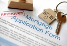 Approved mortgage application form with a house key and keychain