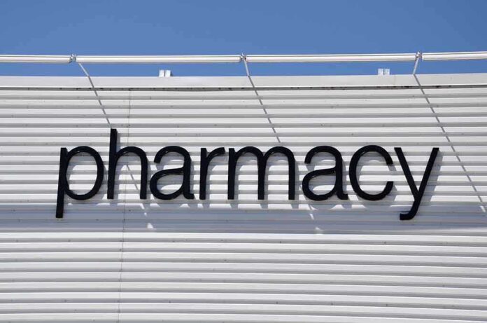 Sign displaying the word pharmacy against a white background
