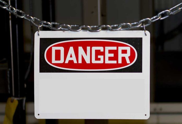 A warning sign displaying the word DANGER in bold red letters