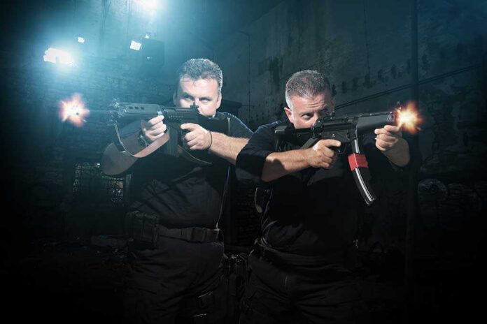 Two tactical operators aiming firearms in a dimly lit urban setting