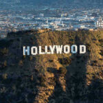 Hollywood ABANDONS California–Look Where The STUDIOS Are GOING The Hollywood sign on a hillside.