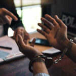Federal Agents ARREST VP Threat Maniac Person handcuffed in discussion with another person