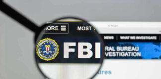 FBI website shown through magnifying glass.