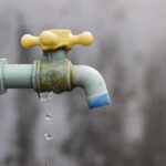 Anti-ICE TRAINING LEAKED — LOOK WHO’S Behind it! Close-up of a dripping outdoor water faucet