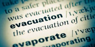 Close-up of a dictionary page showing the definition of evacuation
