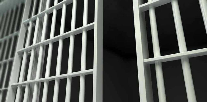 161438378 Close-up of prison cell bars.