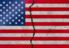 American flag with a large crack through it.