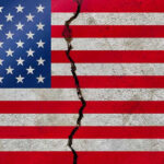 American flag with a large crack through it.