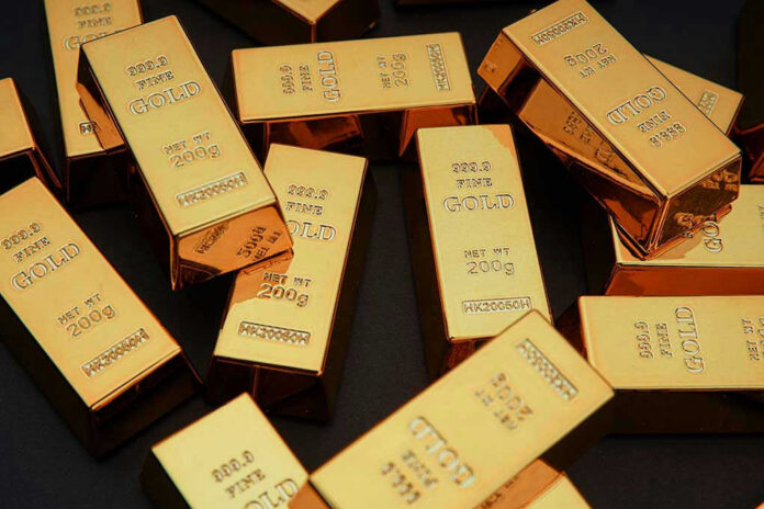 1918648541 Gold bars stacked on dark background