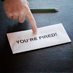 Trump Ally Ousted From DOJ Unit Envelope with YOURE FIRED and pointing finger.