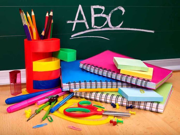 shutterstock_80743891.jpg A collection of colorful school supplies including notebooks, pens, and scissors on a desk