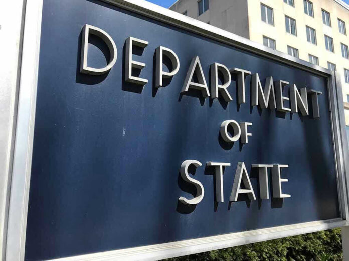 Department of State sign in front of building.
