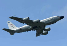B-52 Power Move Stuns Iran Military aircraft flying in clear blue sky.