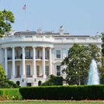 The White House surrounded by gardens and a fountain