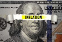 Trump’s Inflation “Over” Claim Sparks Heated Debate A hundred dollar bill with the word 'INFLATION' prominently displayed across it