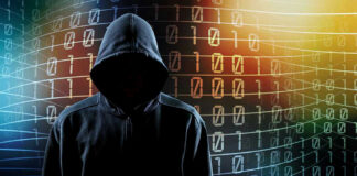 Hooded figure with binary code background.