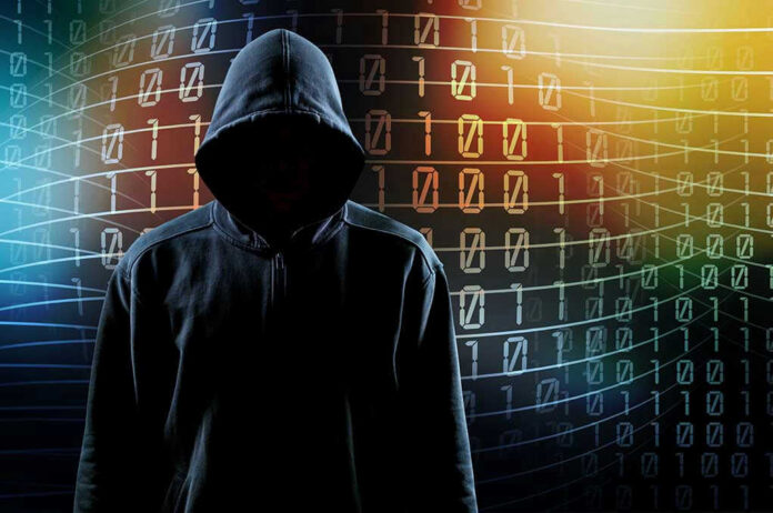 Hooded figure with binary code background.