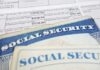 Close-up of social security cards and tax documents showing financial information