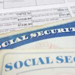 Close-up of social security cards and tax documents showing financial information