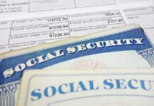 Close-up of social security cards and tax documents showing financial information