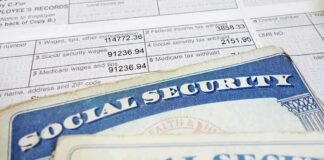 Close-up of social security cards and tax documents showing financial information