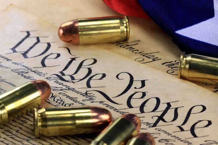 Close-up of bullets surrounding a historical document with the phrase We the People