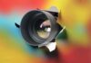 Hidden-Camera BUST Sparks SHOCKING Crackdown Camera lens protruding through a colorful background