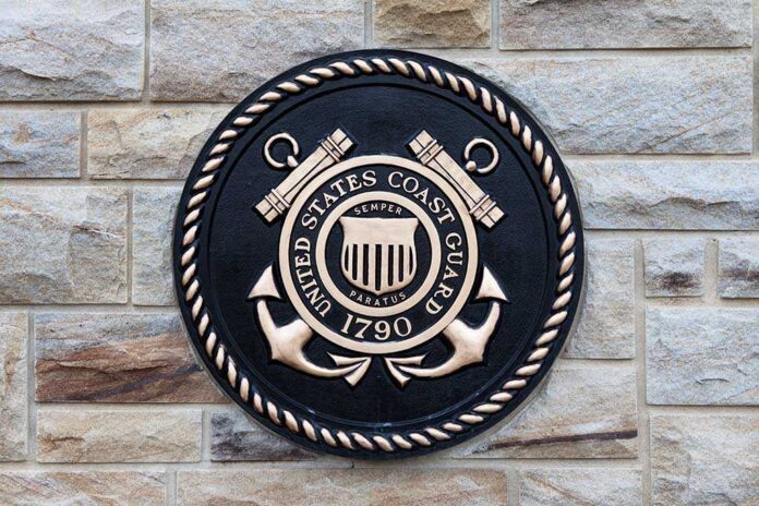 Bronze emblem of the United States Coast Guard mounted on a stone wall