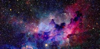 A vibrant cosmic nebula filled with stars and colorful gases