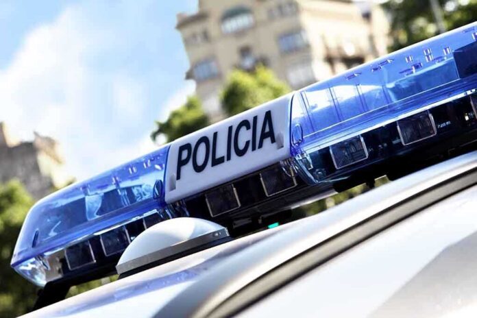 Close-up of a police cars light bar with the word POLICIA