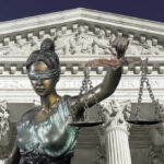 Lawyer Withdraws from High-Stakes Trump Case—Why? Lady Justice statue in front of courthouse.