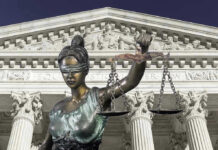 Lawyer Withdraws from High-Stakes Trump Case—Why? Lady Justice statue in front of courthouse.