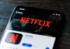 Netflix SPYING on Kids? SCANDAL UNFOLDS Close-up of a smartphone displaying the Netflix app interface