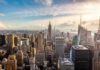 Bezos UNLEASHES Truth Bomb on NYC Aerial view of New York City skyline featuring the Empire State Building at sunset
