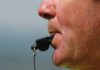 CIA Whistleblower Drops Fauci BOMBSHELL Close-up of a sports coach blowing a whistle