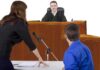 Stabbing Trial SHOCKER: Brother’s Testimony Flips Case A judge presiding over a courtroom with a lawyer speaking to the court