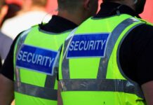 World Cup: FBI Crackdown With No Threats Two security personnel wearing high visibility vests with SECURITY printed on the back