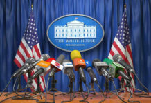 Bombs Or Peace? Trump Draws A Line Multiple microphones at White House press briefing podium.
