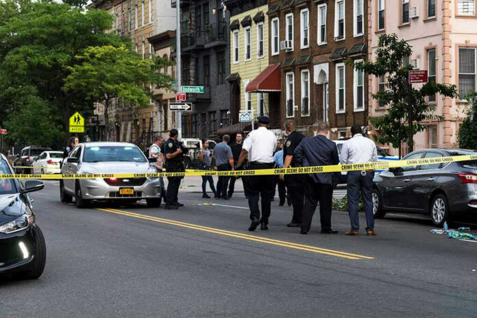 1437619223-2 Police gathered at an urban crime scene.