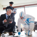 Death Row Verdict Sparks Big Questions Forensic team examining evidence at a crime scene indoors.