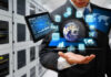 Businessman holding virtual data and analytics hologram.