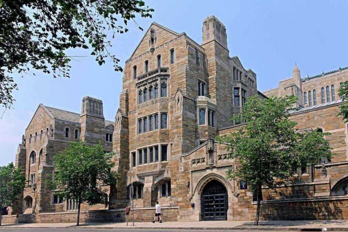 shutterstock_127916003-1 Historic university building with stone facade and surrounding trees