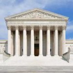 Supreme Court Shifts Asylum Line Front view of the Supreme Court building with large columns and steps under a blue sky