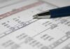 Trillion Hype, Zero Numbers Close-up of a financial document with highlighted numbers and a pen