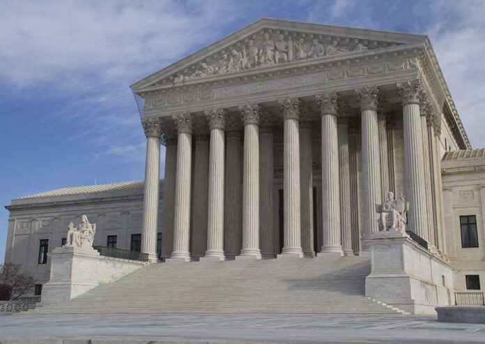 Usa,Supreme,Court,Building,In,Washington,,D.c.,With,A,Cloudy The Supreme Court building featuring large columns and statues