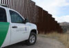 Rideshare Trap: One Ride Request Could End in Arrest Border protection vehicle near a large metal fence.