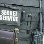 Missed Warnings, Missed Calls—Then the Shots Rang Out Secret Service vest with various tactical gear attached.