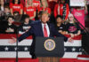 Trump Stuns Crowd With WWII and 9/11 Comparison Politician speaking at rally with supporters behind him.